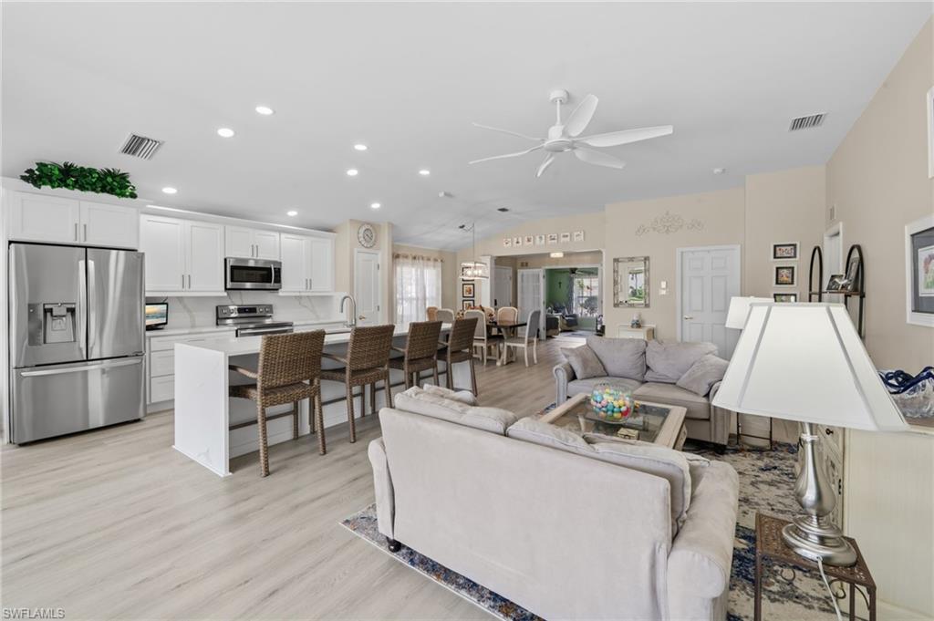 10020 Horse Creek Road Fort Myers, FL 33913 - Photo 5 of 31 a living room with furniture and kitchen view