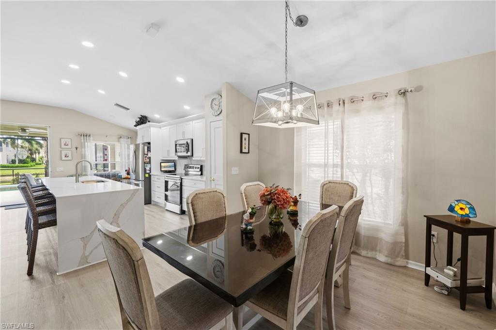 10020 Horse Creek Road Fort Myers, FL 33913 - Photo 6 of 31 a view of a dining room with furniture and chandelier