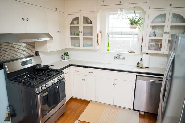 a view of a room with furniture and window