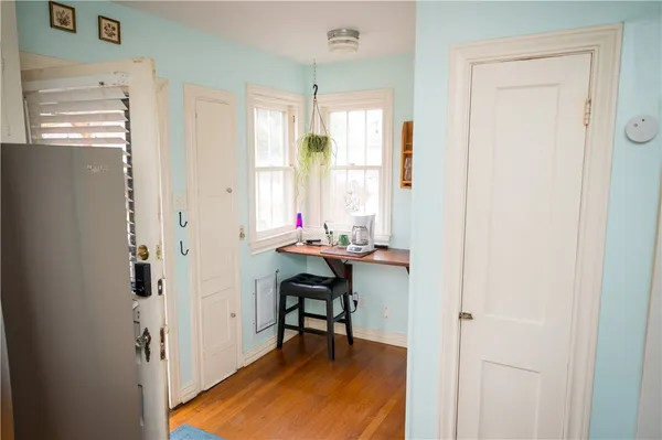a view of a room with window and wooden floor