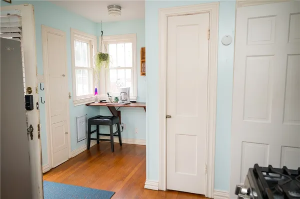 a view of a patio with table and chairs potted plants with wooden floor