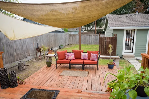 a backyard of a house with outdoor seating