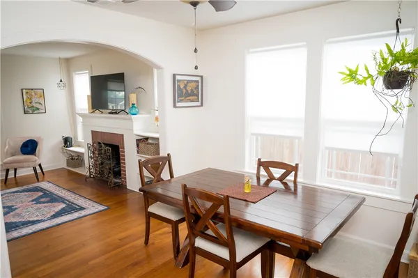 a view of a dining room with furniture window and wooden floor