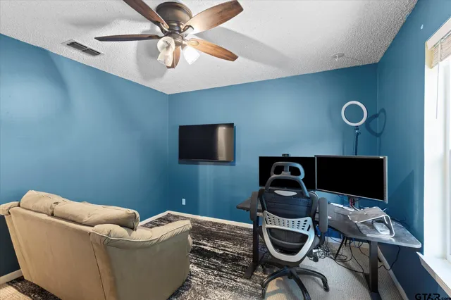 a work room with furniture and musical instruments