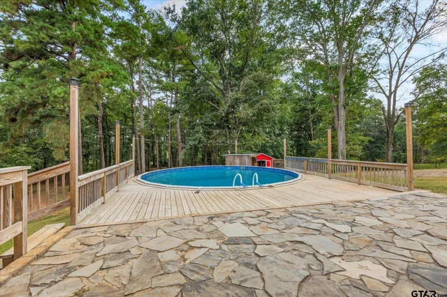 a view of a swimming pool with a patio