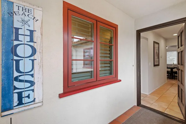 a view of an entryway with wooden floor and door