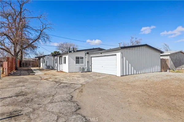 a view of a house with a snow in the yard