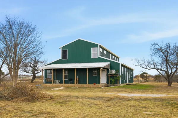 a front view of a house with a ocean view