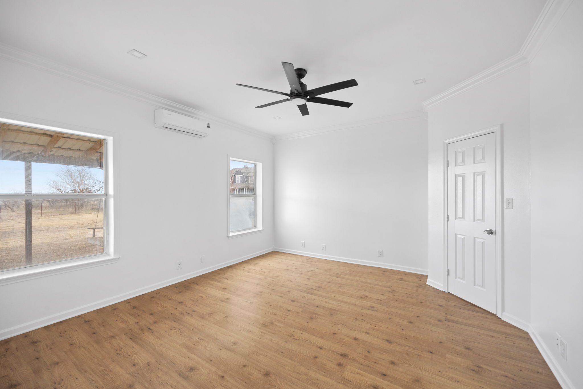 610 Eastview Drive Georgetown, TX 78626 - Photo 12 of 39 a view of empty room with wooden floor and fan