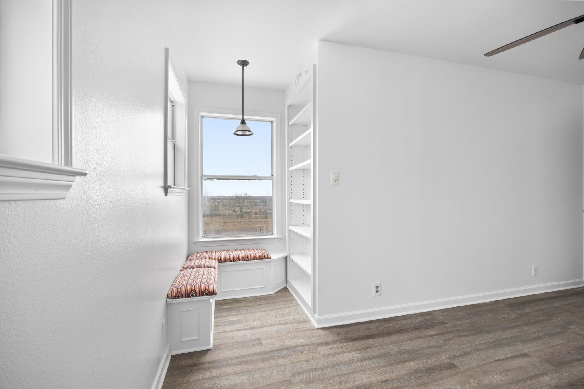 610 Eastview Drive Georgetown, TX 78626 - Photo 16 of 39 a view of wooden floor and windows in a room