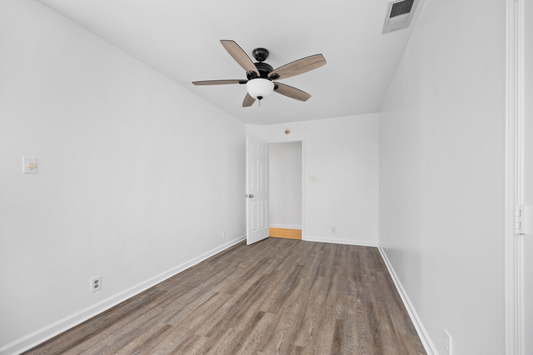 610 Eastview Drive Georgetown, TX 78626 - Photo 17 of 39 a view of a ceiling fan with wooden floor
