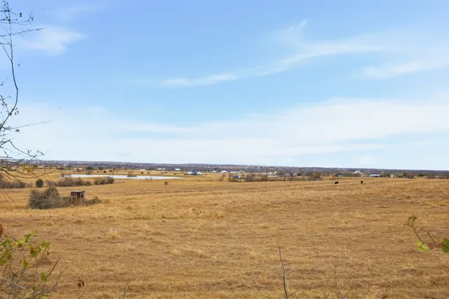 a front view of a building with a yard