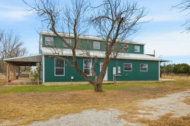 a view of swimming pool with a patio