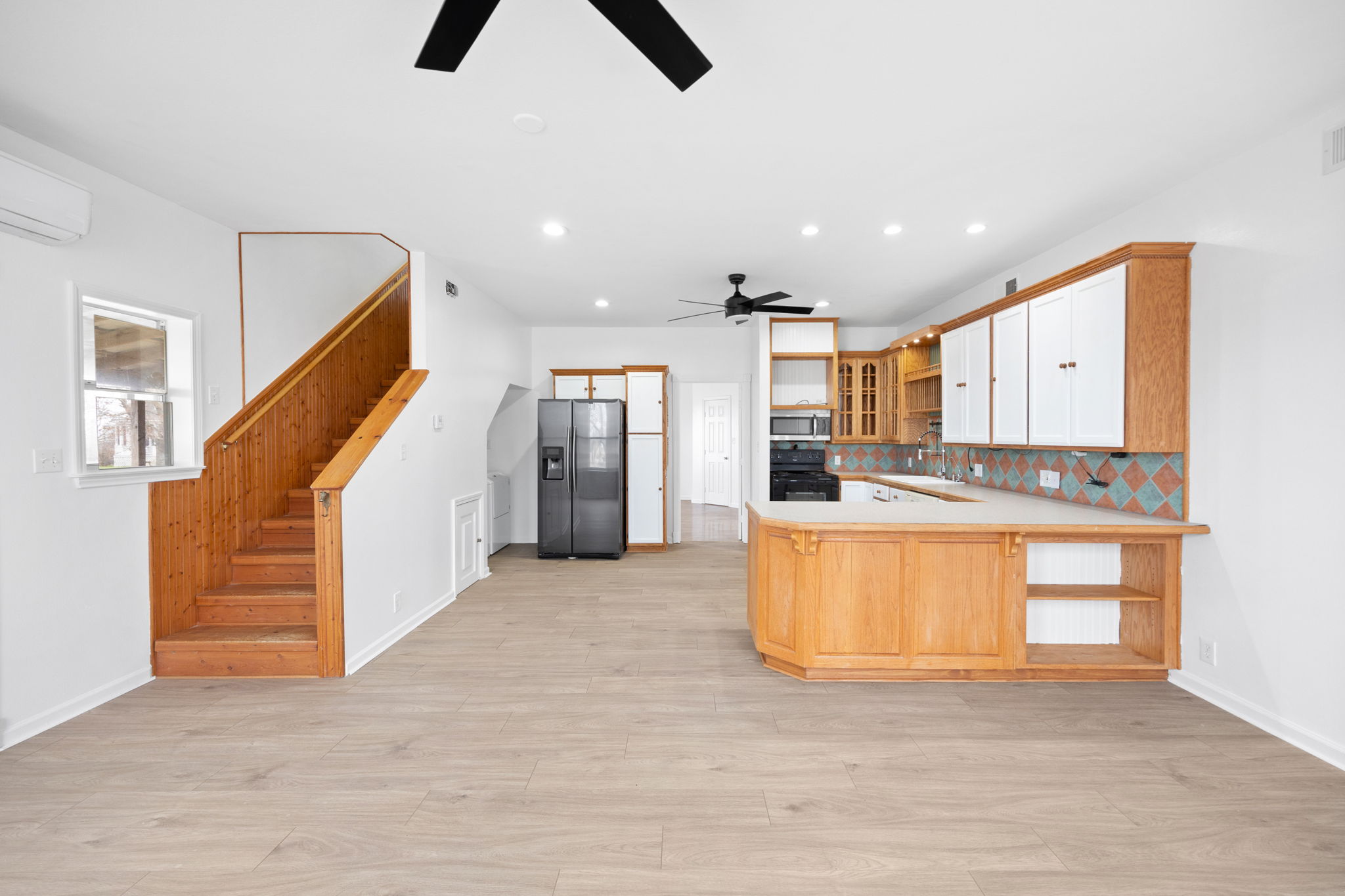 610 Eastview Drive Georgetown, TX 78626 - Photo 6 of 39 a view of kitchen and hall with wooden floor
