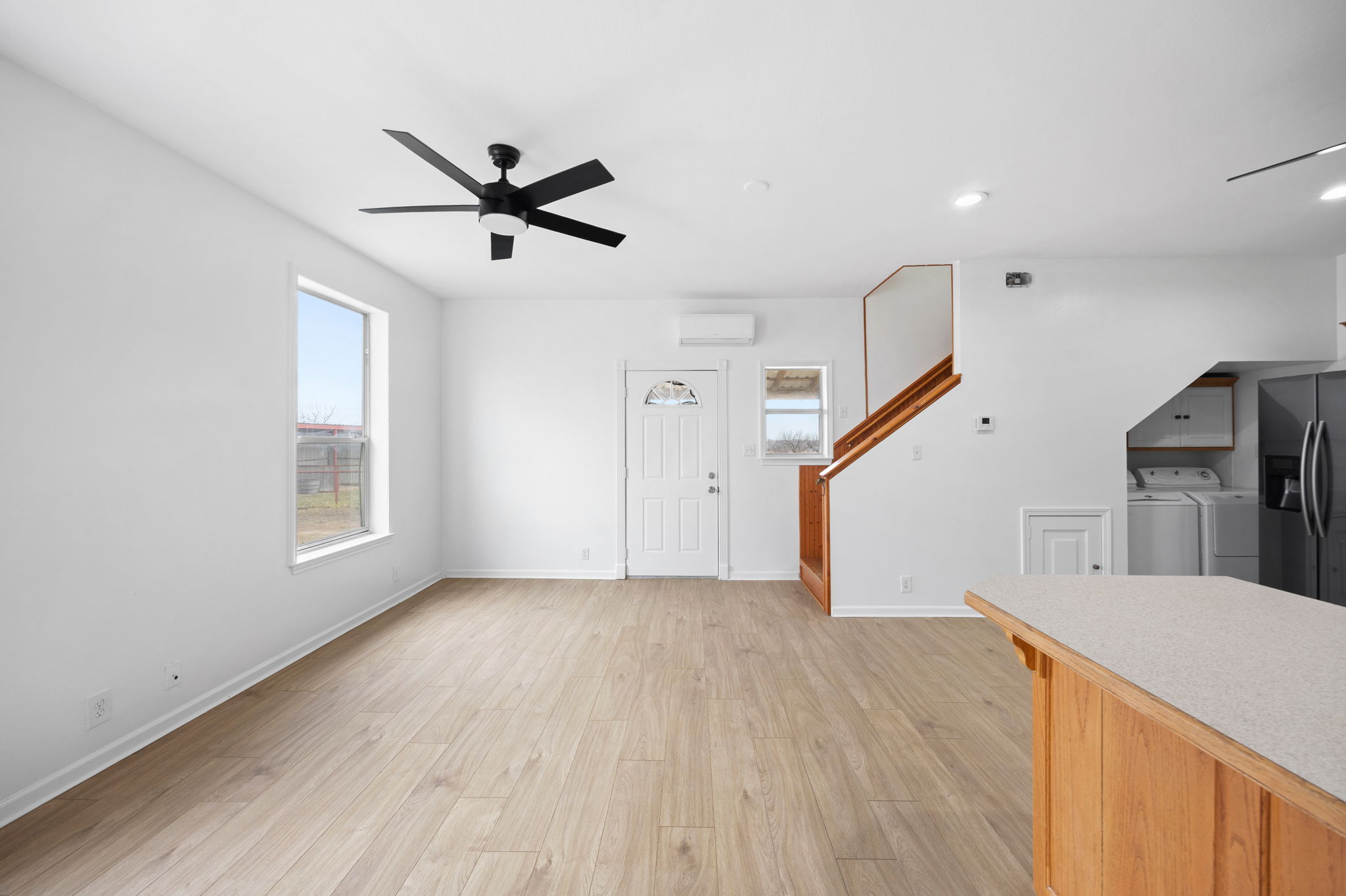 610 Eastview Drive Georgetown, TX 78626 - Photo 8 of 39 a view of an empty room with wooden floor and a window
