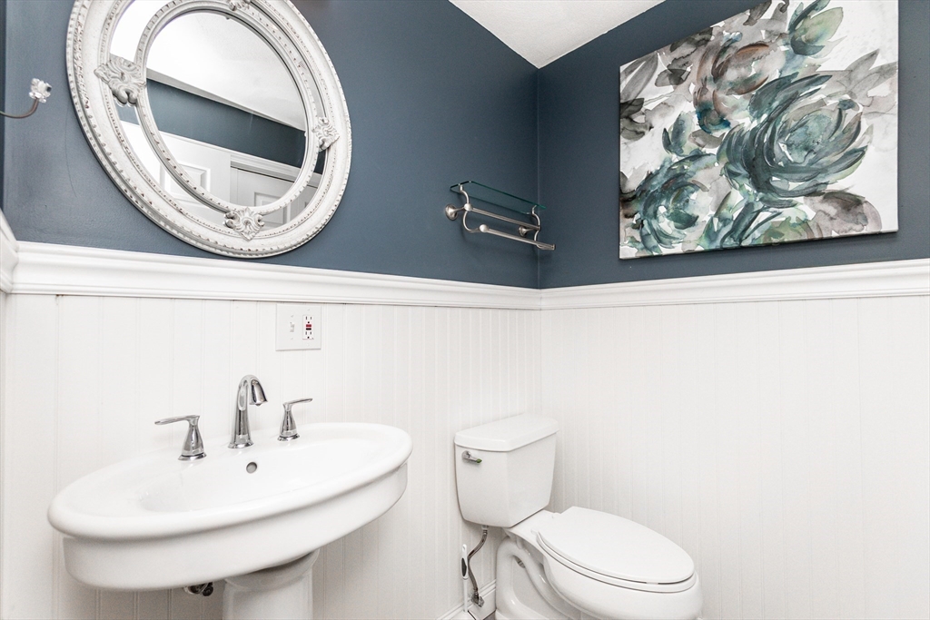 63 Bow Street Saugus, MA 01906 - Photo 12 of 42 a bathroom with a toilet and a sink