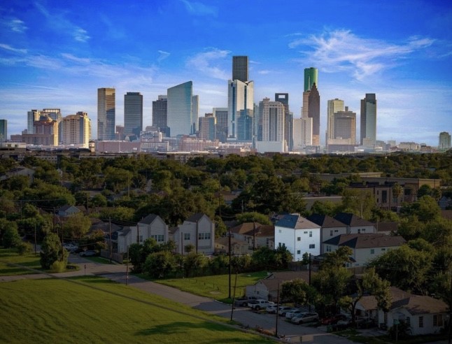 a front view of a residential apartment building with a yard