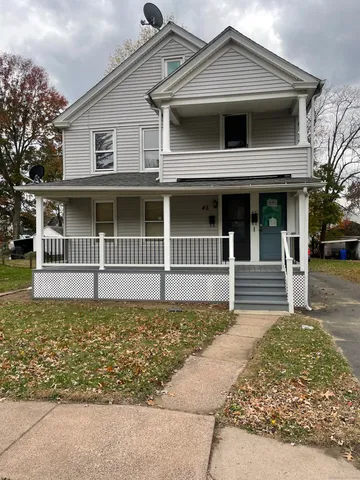 a front view of a house with a fence