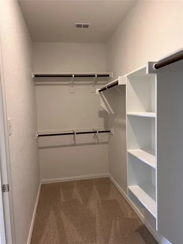 a view of an empty walk in closet