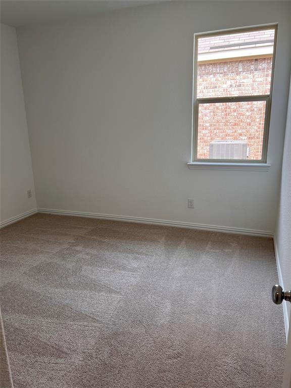 252 Ardsley Lane Princeton, TX 75407 - Photo 12 of 33 an empty room with a window