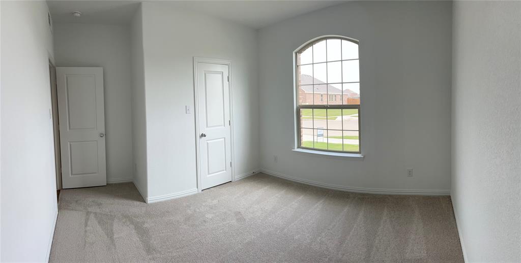 252 Ardsley Lane Princeton, TX 75407 - Photo 16 of 33 an empty room with windows