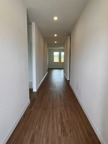 a view of gallery with wooden floor