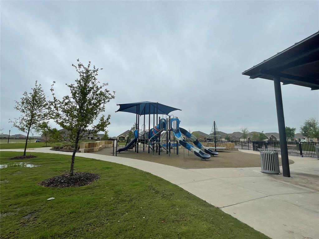 252 Ardsley Lane Princeton, TX 75407 - Photo 28 of 33 a view of a backyard with sitting area