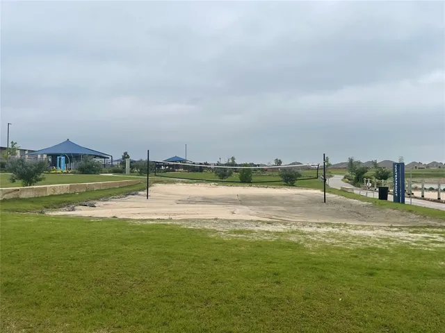 a view of a house with a yard and a large window