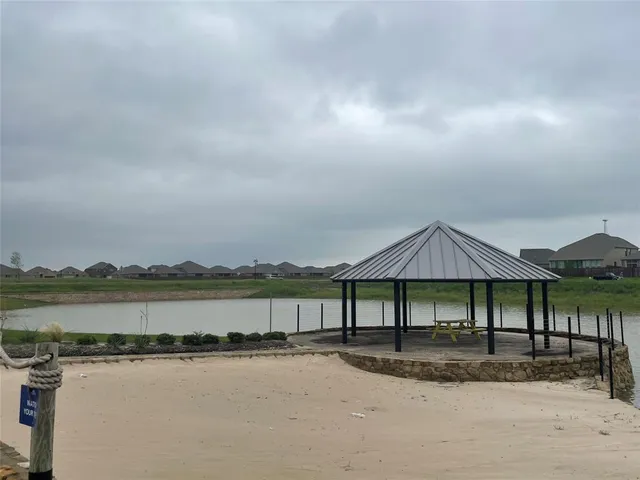 a view of a swimming pool with a yard