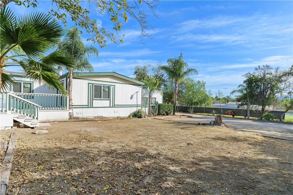 33462 Loquat Street Wildomar, CA 92595 - Photo 8 of 41 a view of a house with a yard and trees