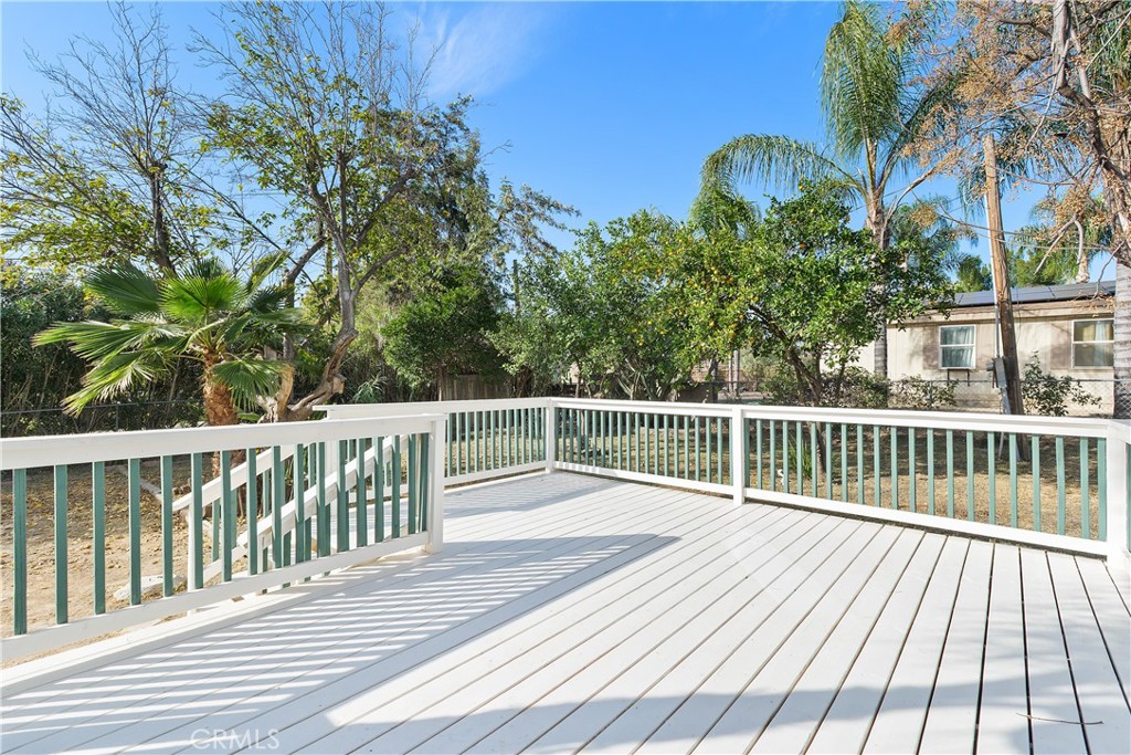 33462 Loquat Street Wildomar, CA 92595 - Photo 9 of 41 a view of balcony with wooden floor and fence