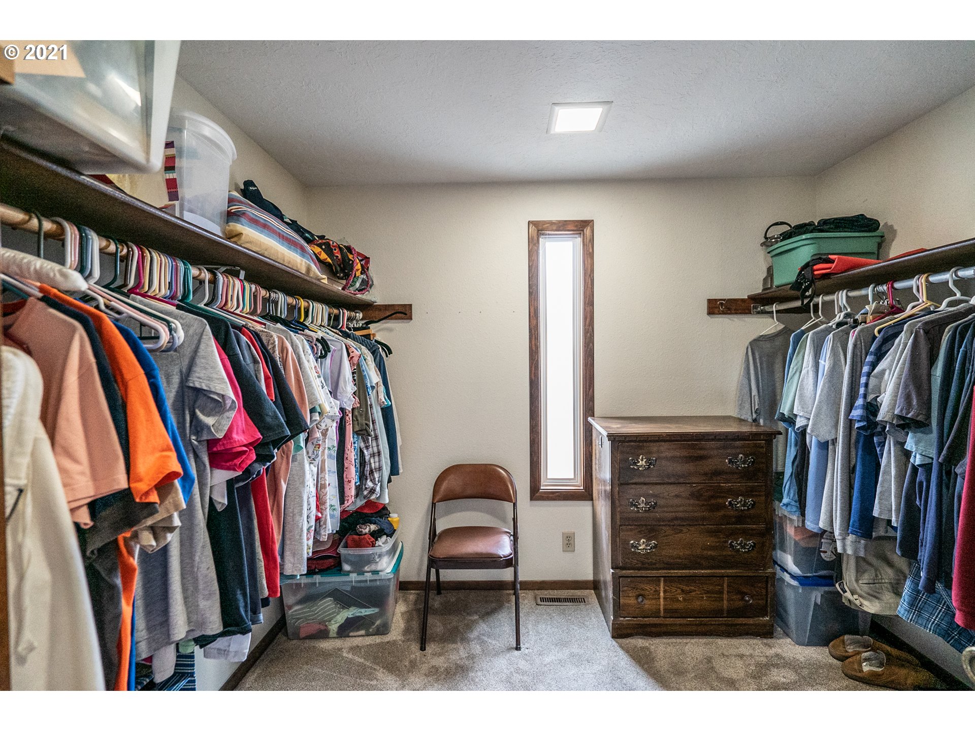 9657 South Kraxberger Road Canby, OR 97013 - Photo 17 of 32 a view of walk in closet with clothes and shoes