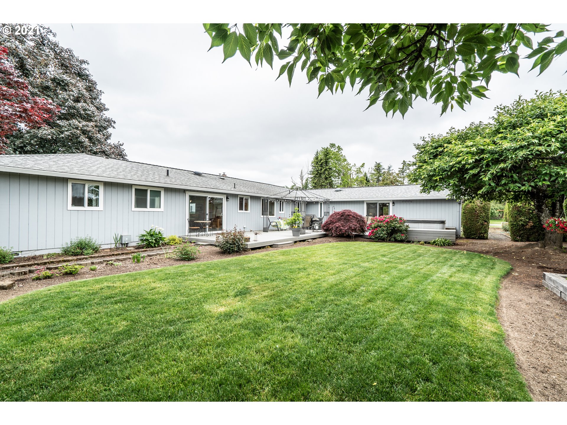 9657 South Kraxberger Road Canby, OR 97013 - Photo 22 of 32 a front view of house with yard and trees in the background