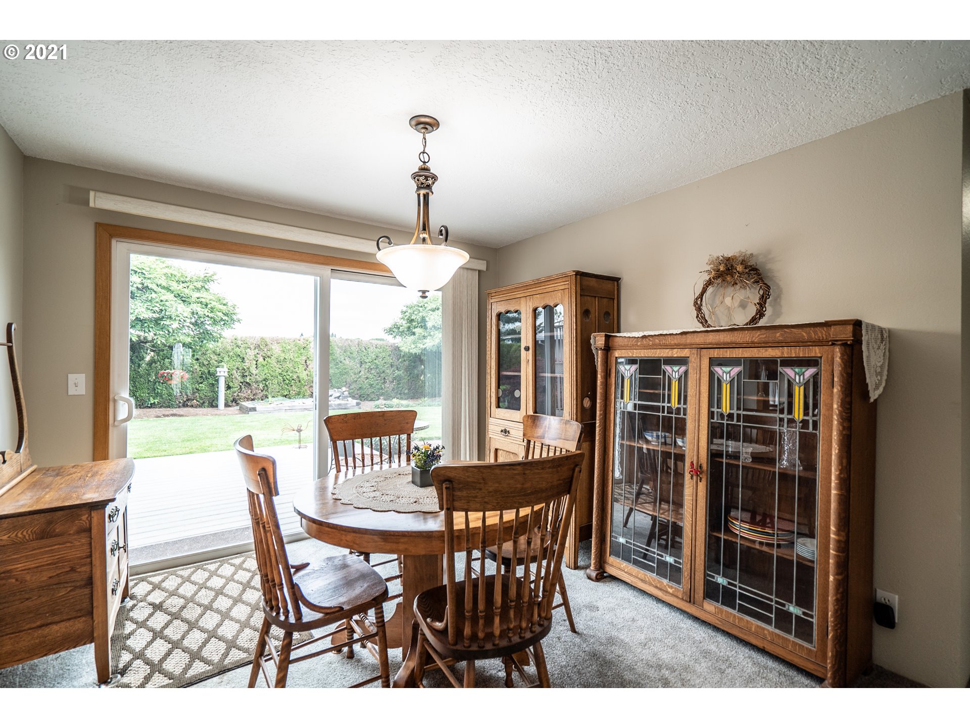 9657 South Kraxberger Road Canby, OR 97013 - Photo 10 of 32 a view of a dining room with furniture window and outside view