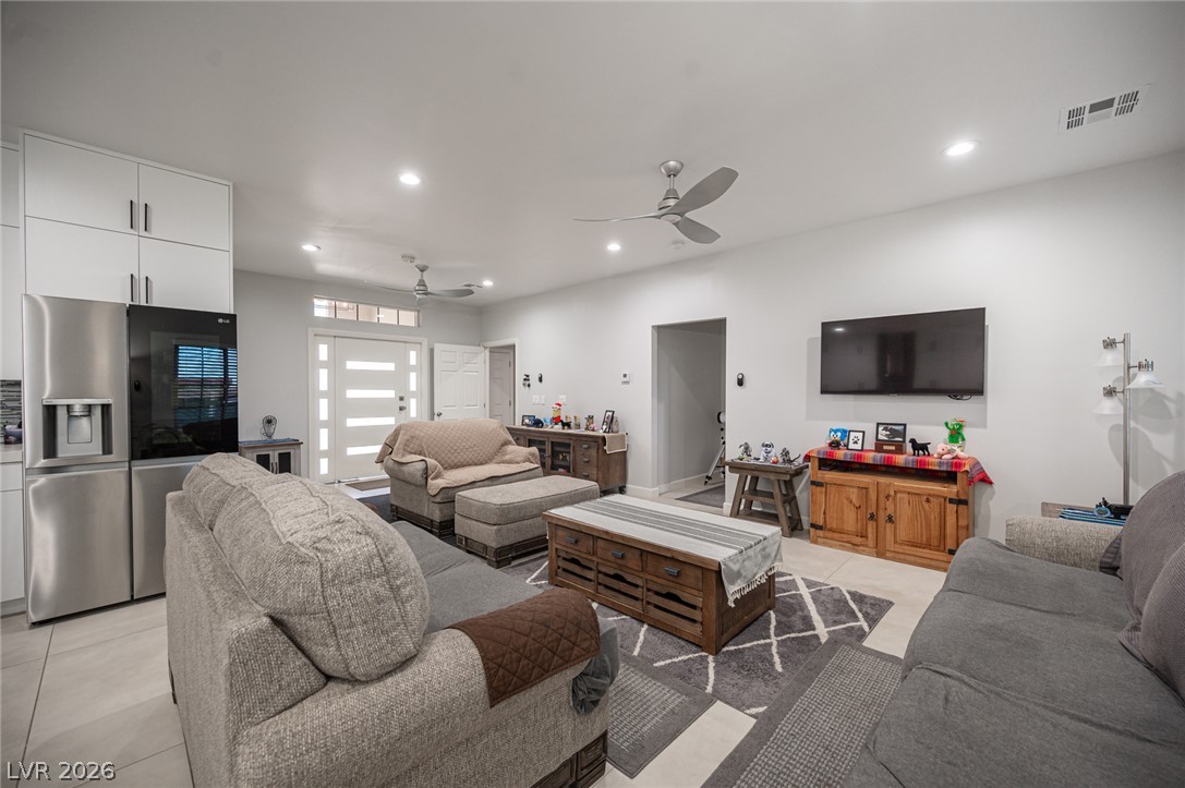 441 Belville Road Pahrump, NV 89048 - Photo 9 of 44 A comfortable gathering space features contemporary ceiling fans and ample recessed lighting.
