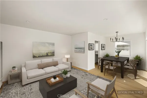 a living room with furniture a rug and a table