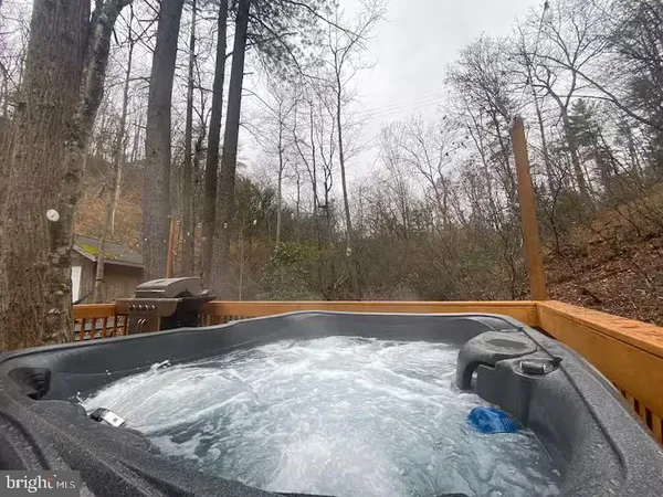 a view of a bench in the backyard