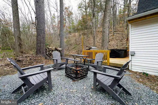 a view of a balcony with chairs