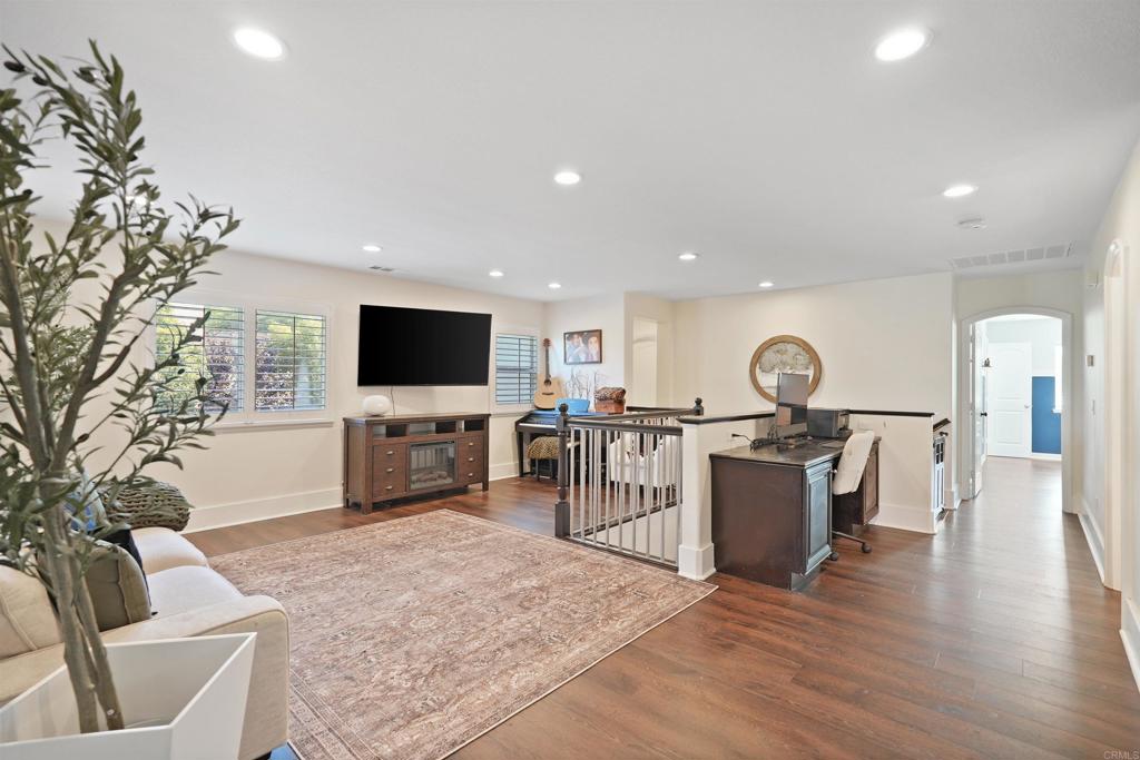 25351 Forest Street Corona, CA 92883 - Photo 12 of 72 a living room with furniture and a flat screen tv