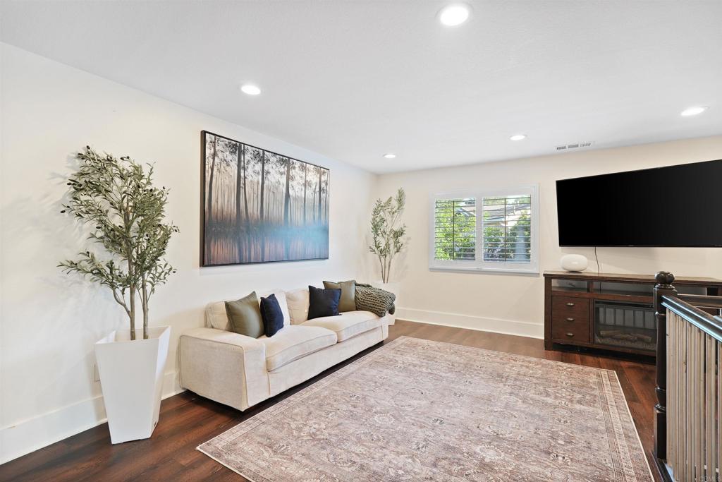 25351 Forest Street Corona, CA 92883 - Photo 16 of 72 a living room with furniture and a flat screen tv