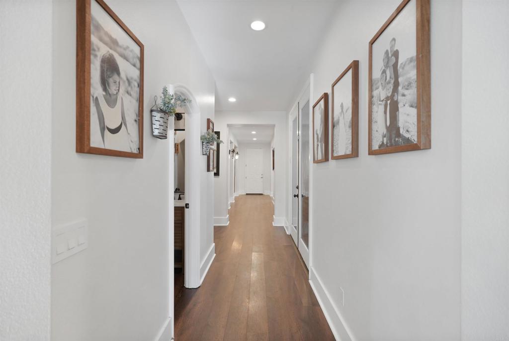 25351 Forest Street Corona, CA 92883 - Photo 18 of 72 a view of a hallway with paintings on the wall