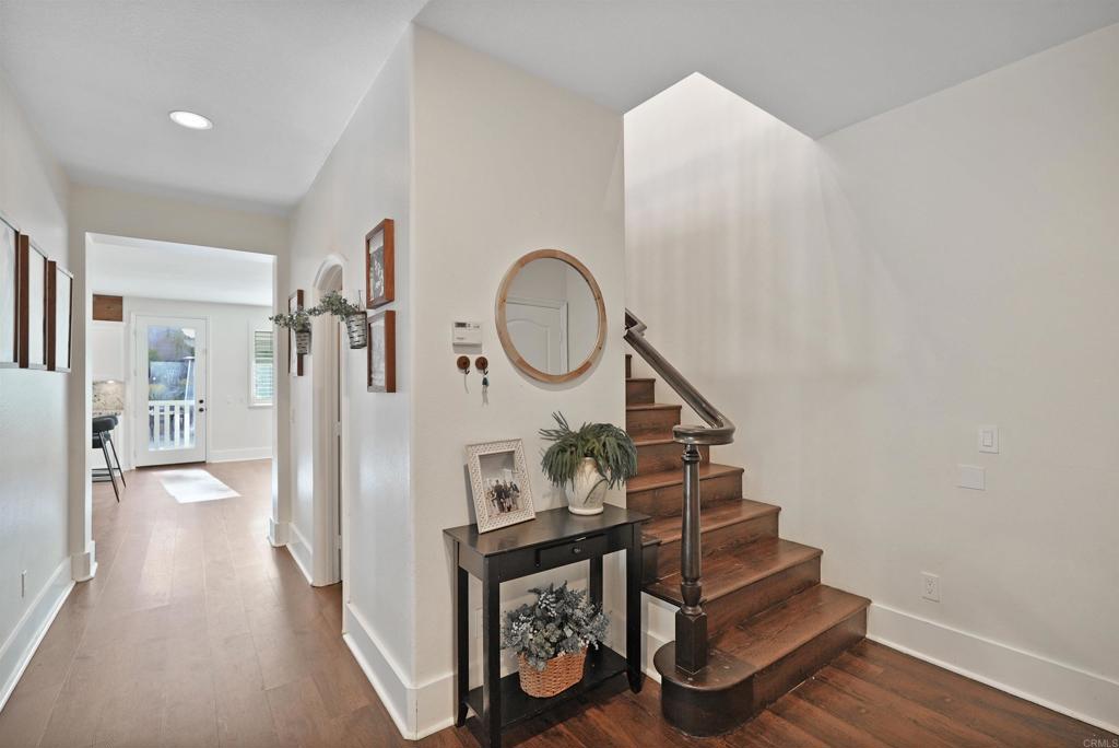 25351 Forest Street Corona, CA 92883 - Photo 23 of 72 a view of a hallway with entryway wooden floor and front door