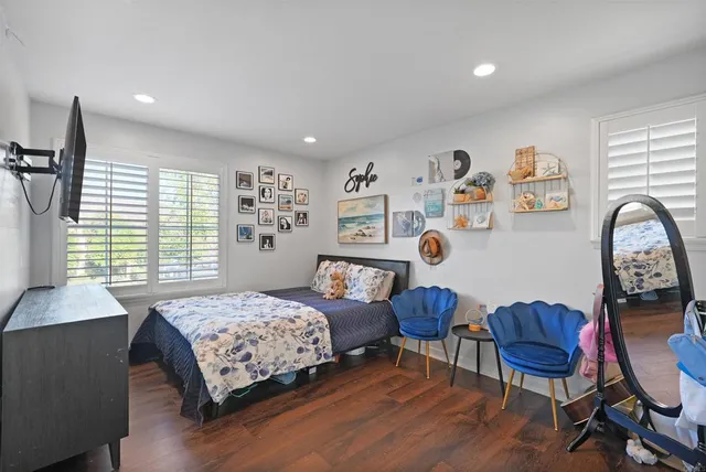a bathroom with a bathtub sink and mirror