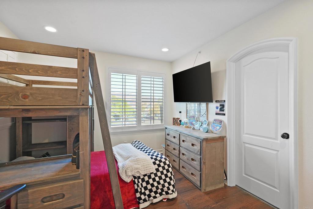 25351 Forest Street Corona, CA 92883 - Photo 33 of 72 a living room with furniture and a flat screen tv