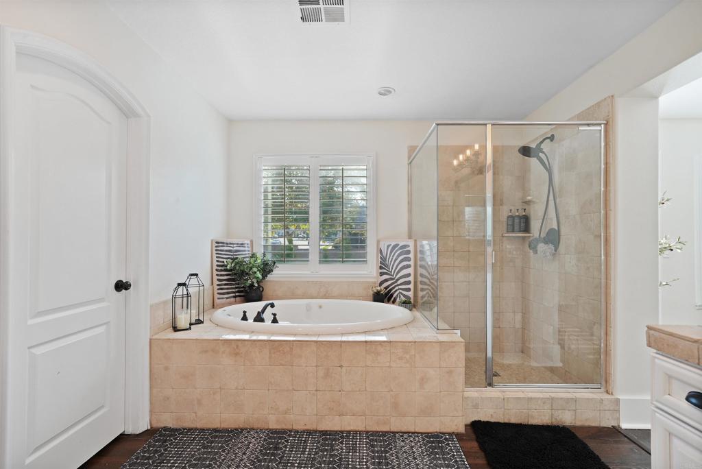 25351 Forest Street Corona, CA 92883 - Photo 35 of 72 a white bath tub sitting in a bathroom next to a window