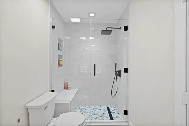 a view of a balcony with wooden floor