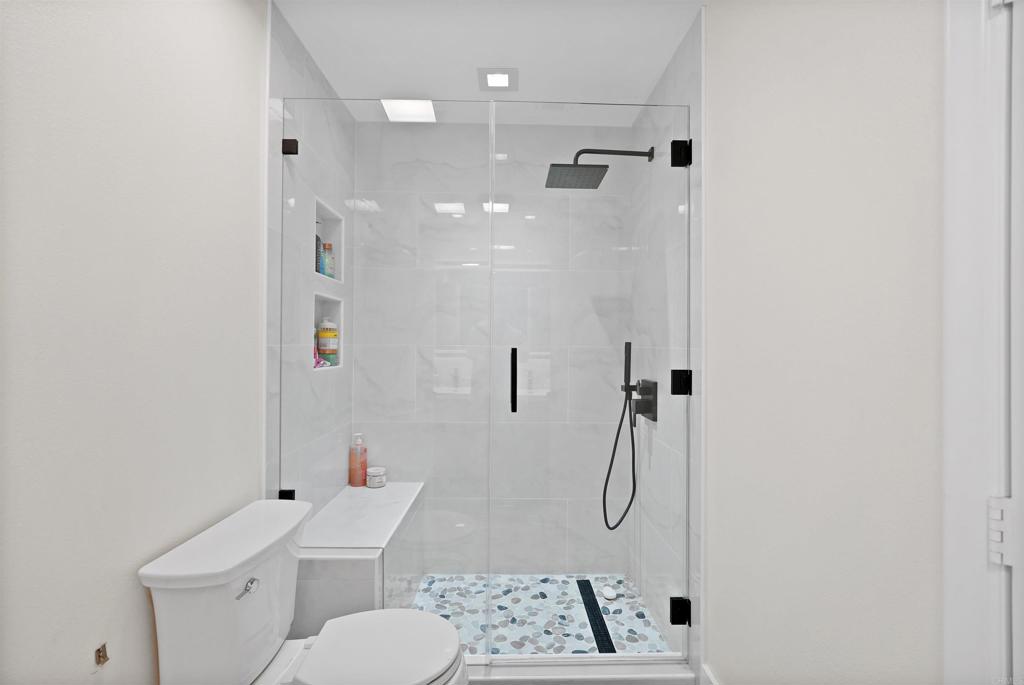 25351 Forest Street Corona, CA 92883 - Photo 39 of 72 a bathroom with a shower a toilet and a shower