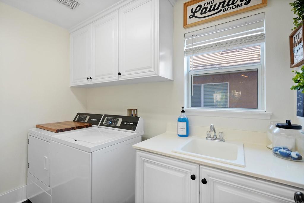 25351 Forest Street Corona, CA 92883 - Photo 40 of 72 a utility room with dryer and washer