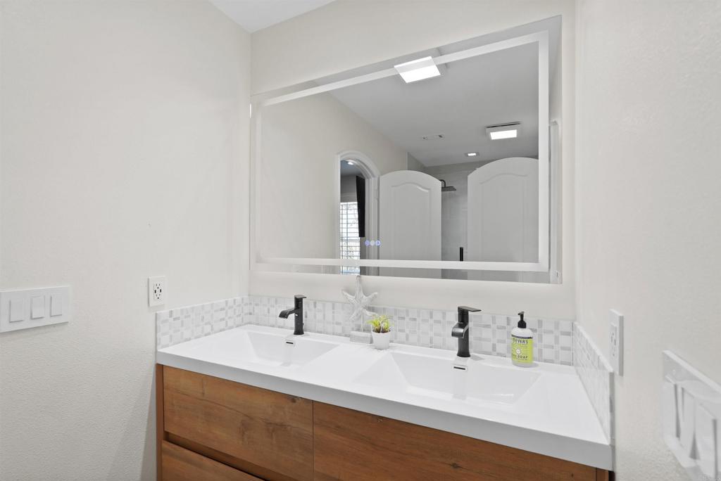 25351 Forest Street Corona, CA 92883 - Photo 43 of 72 a bathroom with a sink vanity and a mirror