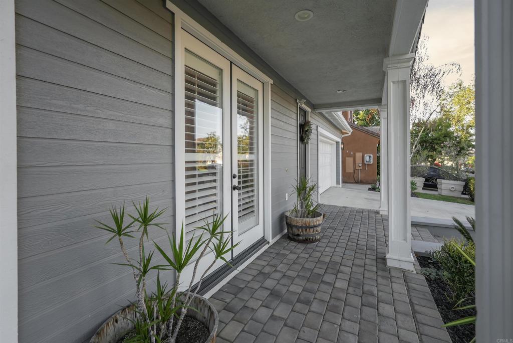 25351 Forest Street Corona, CA 92883 - Photo 48 of 72 a potted plant in front of a glass door